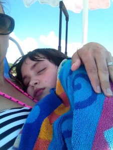 Holding her in my lap after a seizure at the beach. Just being her Mom. 